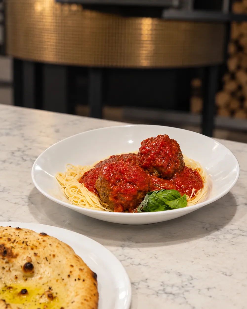 Angel hair pasta with homemade meatballs and garlic focaccia