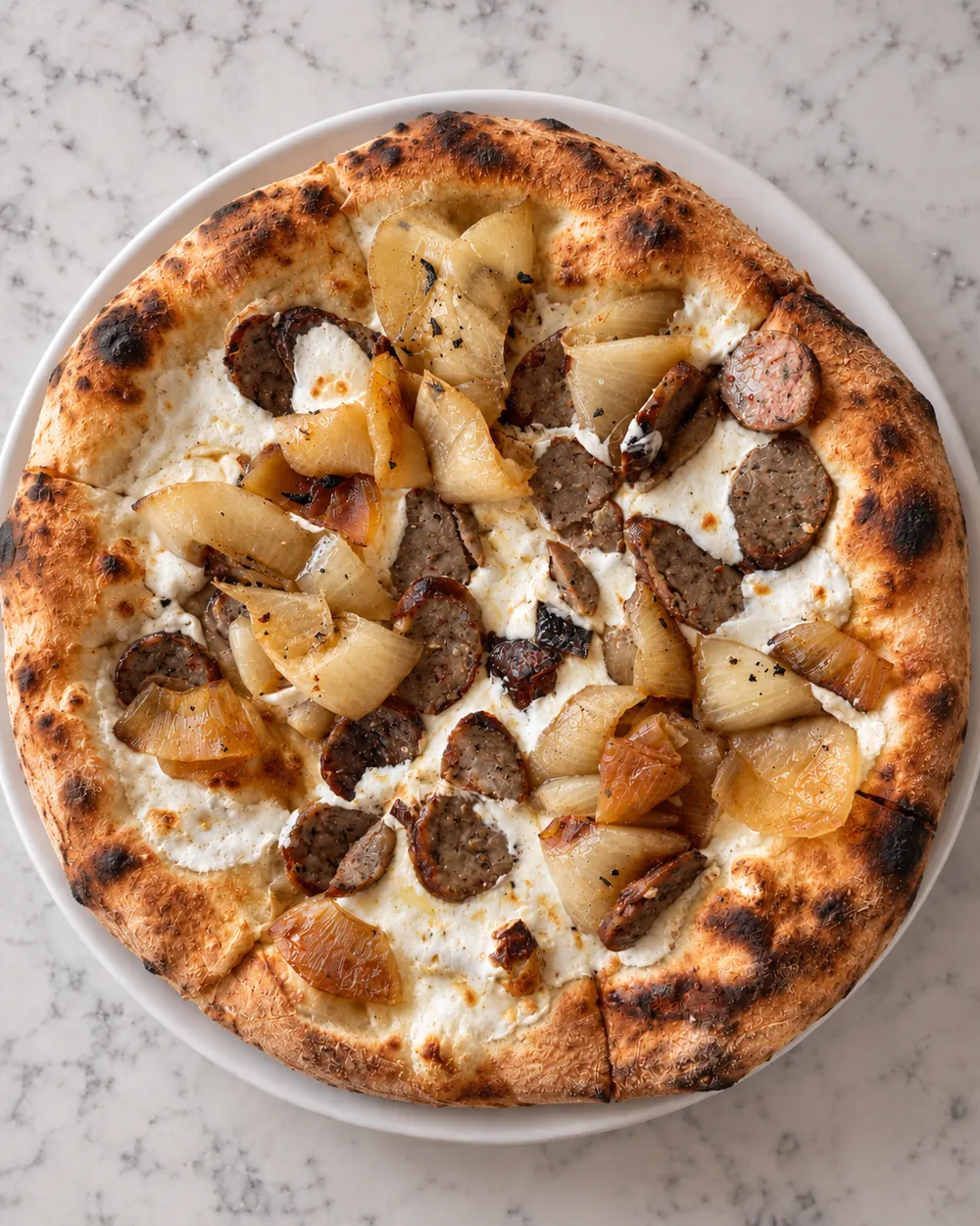 The Big Guy pizza with wood roasted onion, smoked mozzarella and sausage