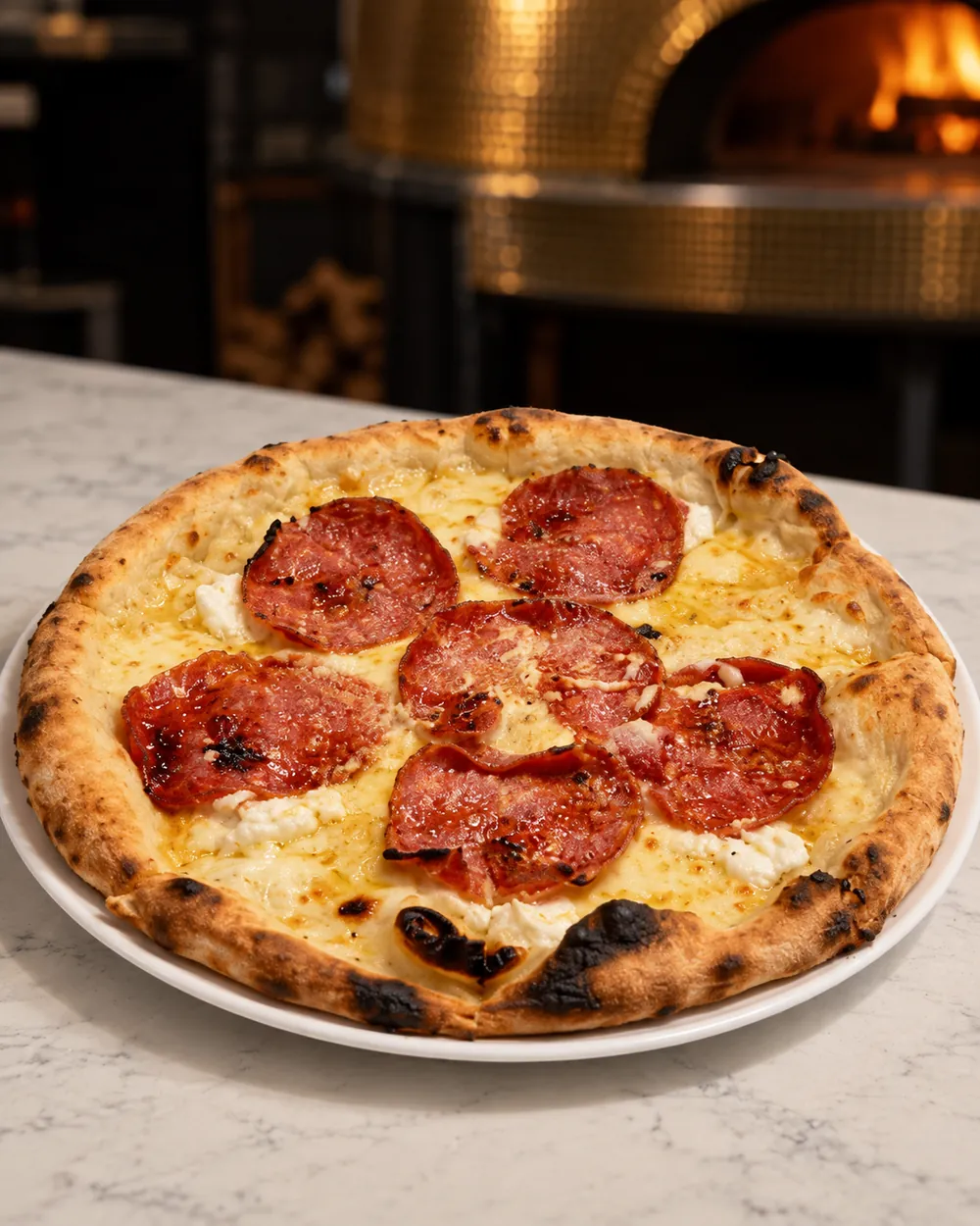 Vesuvio pizza with spicy soppressata and ricotta